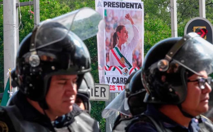 Mientras cárteles reclutan exmilitares colombianos; Sheinbaum pide sanciones a policías